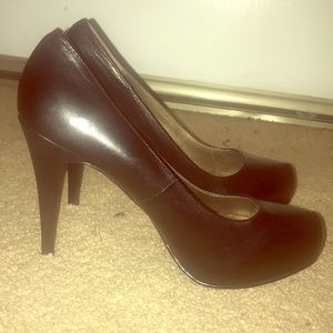 Black leather pumps